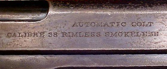 Right side slide inscription - "AUTOMATIC COLT" over "CALIBRE 38 RIMLESS SMOKELESS"
