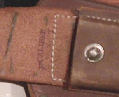 32 CALIBER COLT markings inside flap of magazine pouch.