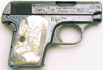 Model N Factory Gold Inlaid with Factory Carved Mother-of-Pearl Grips.